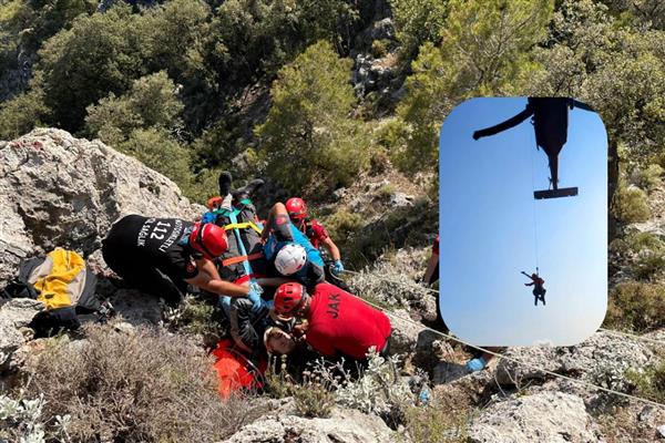 Babadağ'dan atlayan Belaruslu paraşütçü rüzgar nedeniyle kayalıklara düşünce helikopterle kurtarıldı